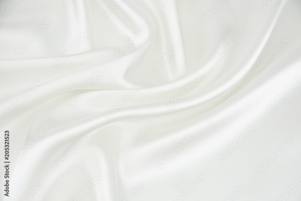 The texture of the satin fabric of white color for the background  