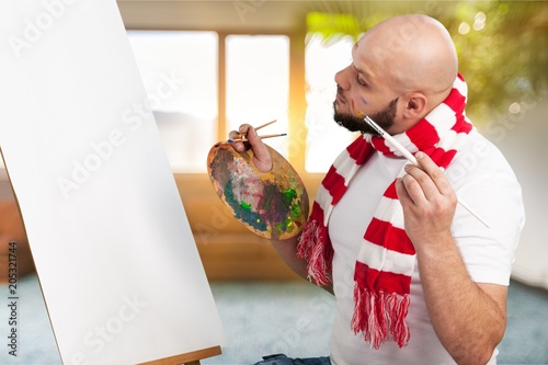 Man painter with a paintbrush