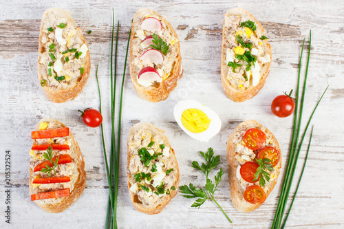 Baguette or sandwiches with mackerel or tuna fish paste and ingredients for preparing meal