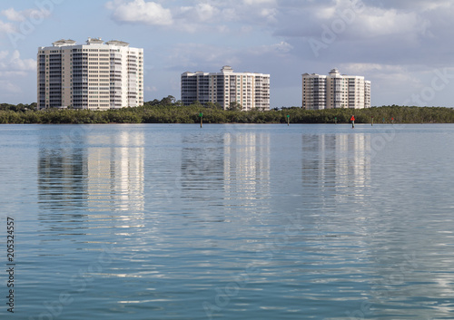 Reflection of Buildings on Calm Bay