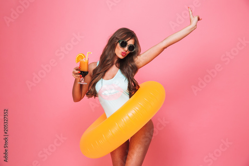 Portrait of a happy young woman dressed in swimsuit
