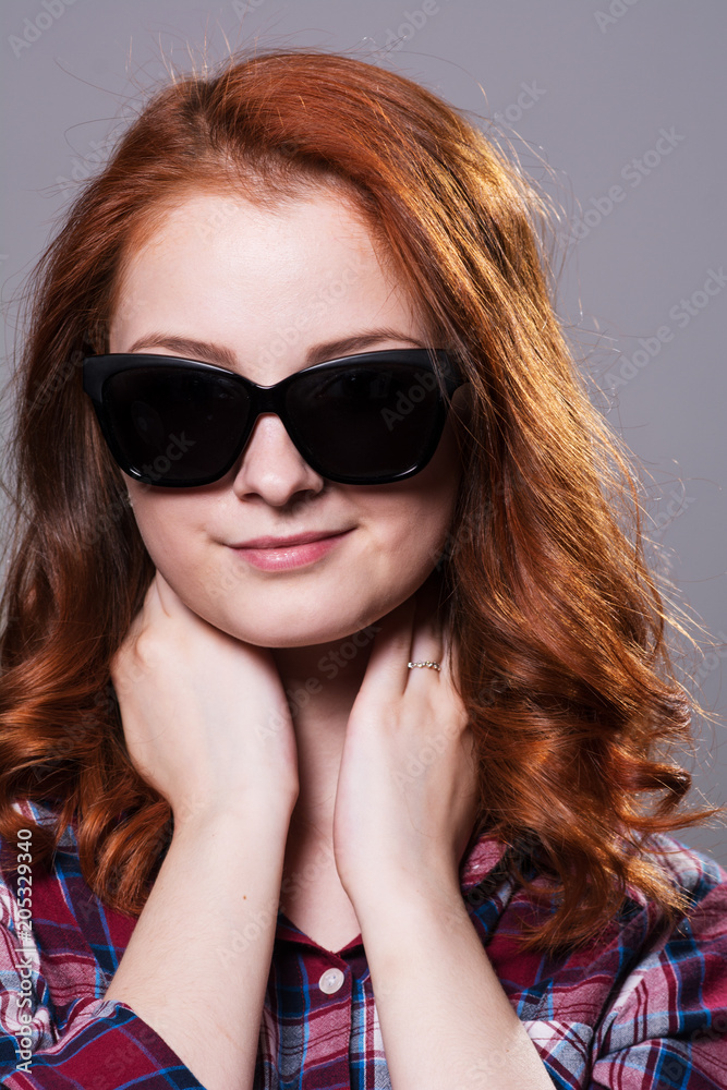 Close-up portrait of a young girl in sunglasses Close-up portrait of a young girl in sunglasses