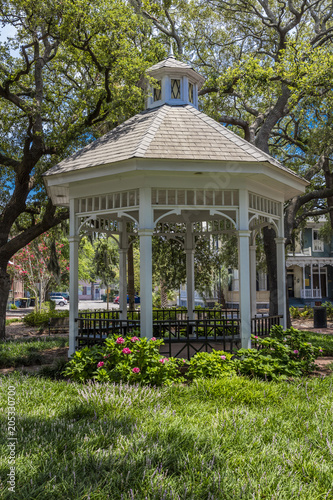 JUNE 28, 2017 - SAVANNAH GEORGIA - Historic Savannah Georgia in early summer features a white gazebo in one of many town parks