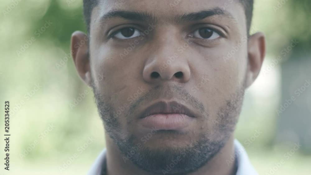 Close up Portrait of Young African American man outdoor Close up Portrait of Young African American man outdoor
