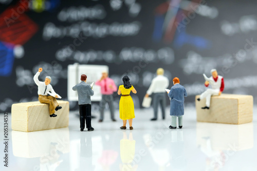 Miniature people : reading a book with teacher,Education concept.