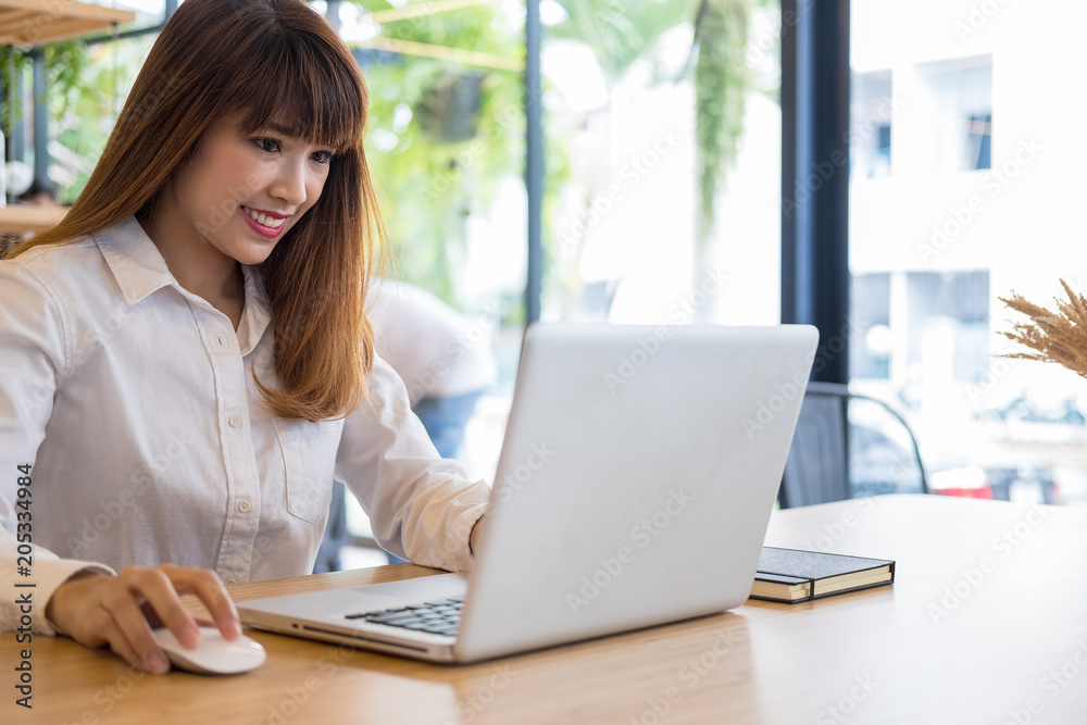 young businesswoman working with mobile laptop and documents in office, business concept young businesswoman working with mobile laptop and documents in office, business concept