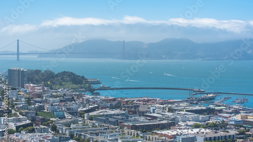 Photography San Francisco, the Embarcadero with the marina, and the Golden Gate Bridge in ba