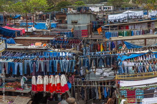 Dhobi Ghat Mumbai Laundry. Dhobi Ghat is a well known open air laundromat in Mumbai, India. The washers, known as dhobis, work in the open to clean clothes and linens from Mumbai's hotels and hospital photo