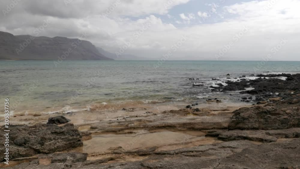 view of the north coast of Lanzarote from the neighboring island of La Graciosa view of the north coast of Lanzarote from the neighboring island of La Graciosa