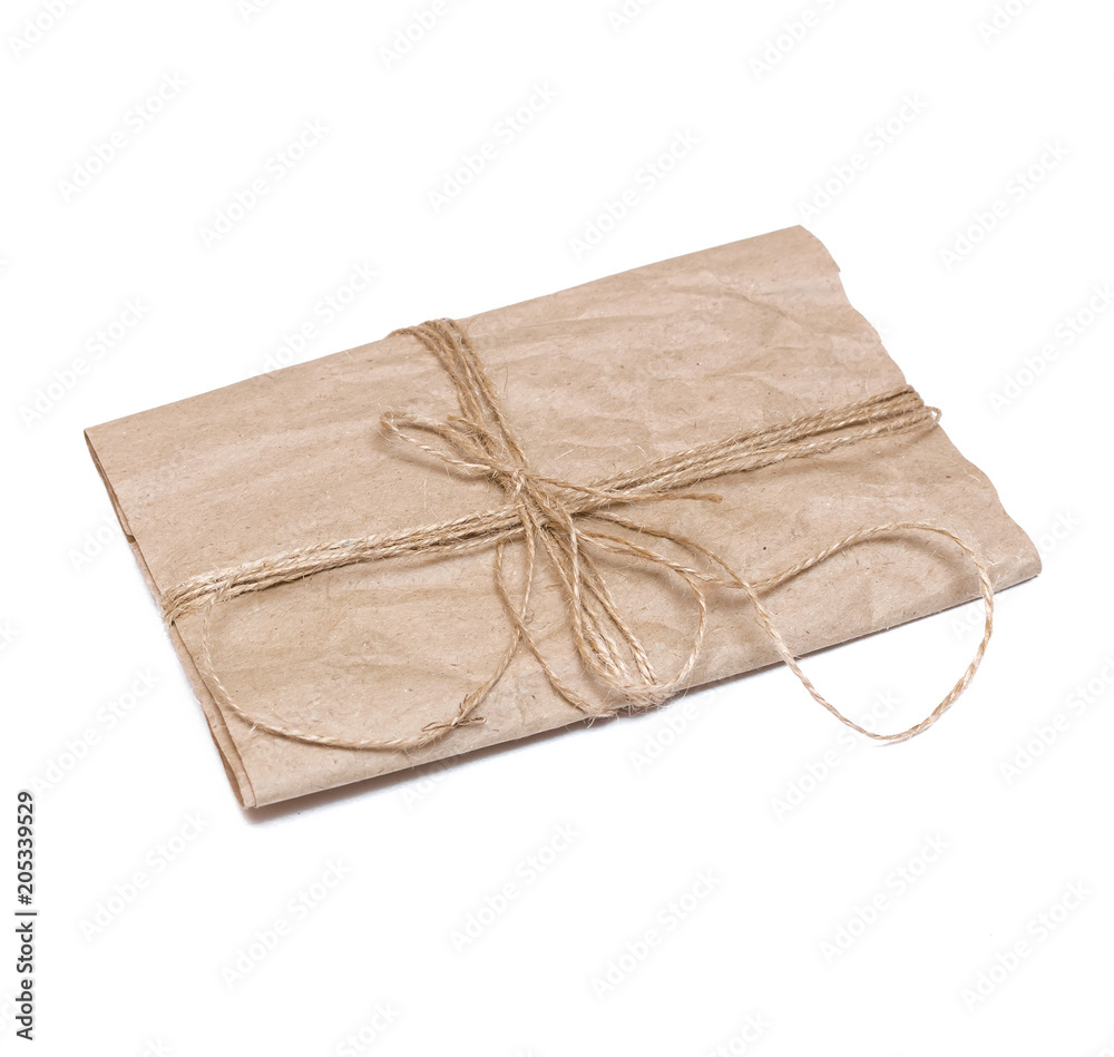 Old letter paper page tied with jute rope isolated on white background. Old letter paper page tied with jute rope isolated on white background.