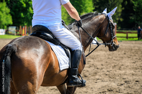Unrecognizable horse rider on an equestrian event