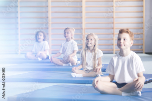 Amazed children in yoga classes