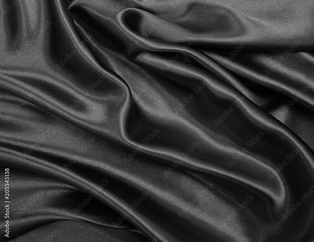 Smooth elegant black silk or satin texture as abstract background. Luxurious background design Smooth elegant black silk or satin texture as abstract background. Luxurious background design