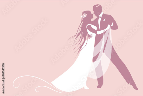 Elegant groom and beautiful bride with long mane dancing the wedding dance