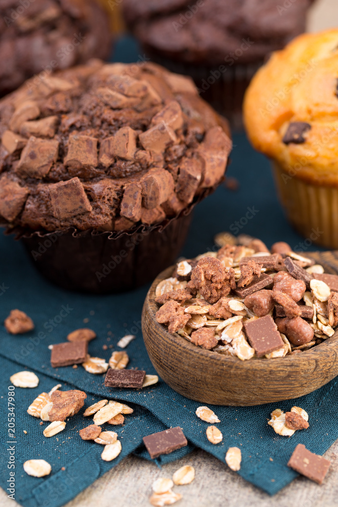 Fototapeta premium Homemade muffins with chocolate, vintage background.
