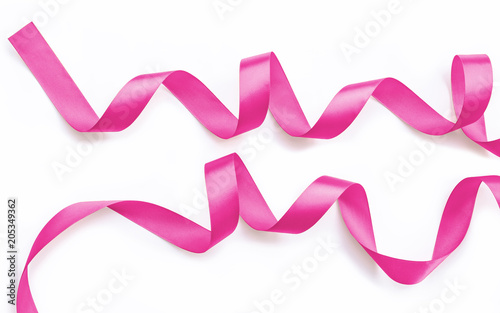 Pink rose fuchsia color satin ribbon for  valentines' day decoration isolated on white background