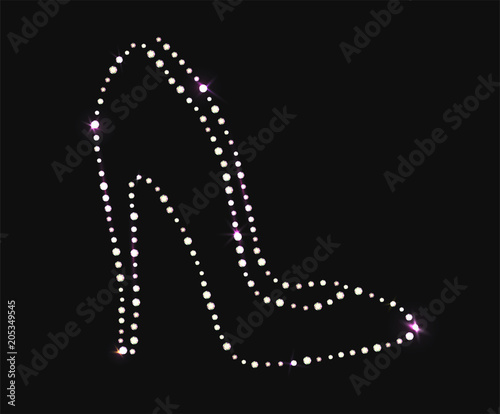 High heel shoe of beautiful gems on dark background