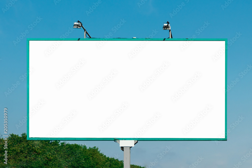 Billboard, billboard, canvas billboard, layout against the blue sky. The concept of outdoor advertising, marketing, sales. mockup Billboard, billboard, canvas billboard, layout against the blue sky. The concept of outdoor advertising, marketing, sales. mockup