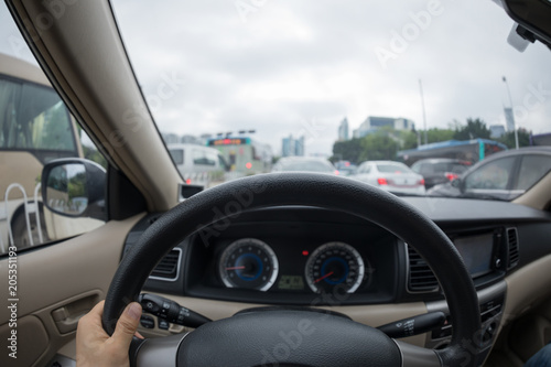 Driving car on city street in traffic jam © lzf