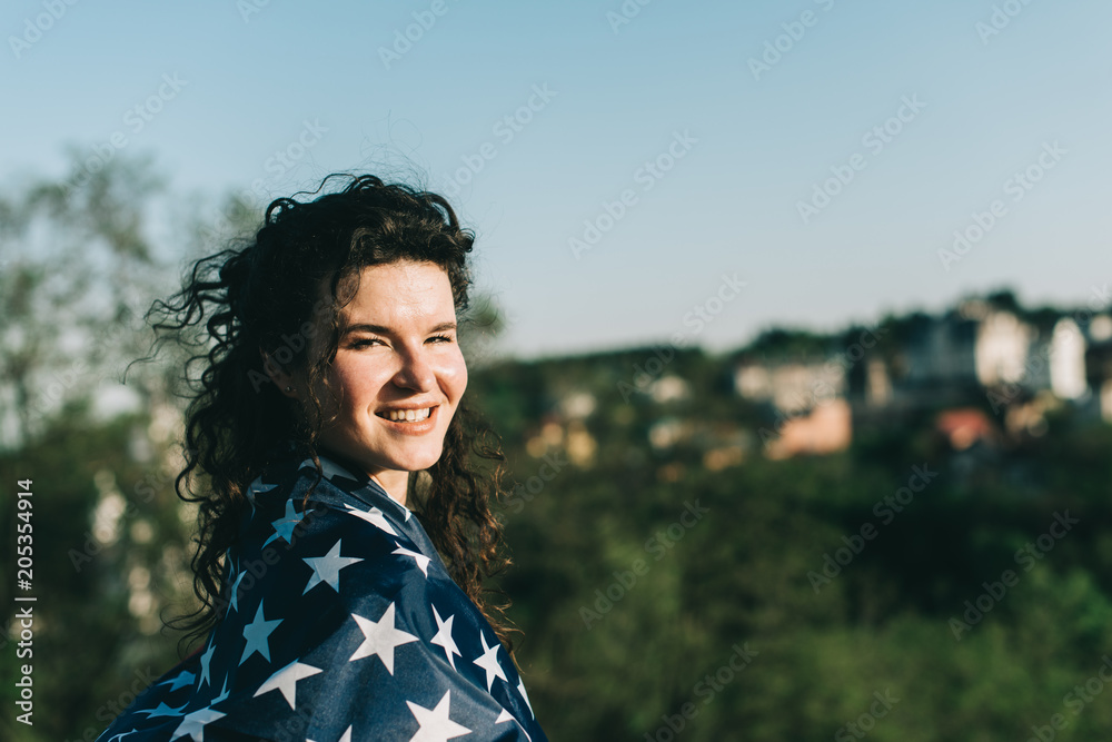 Girl with an American flag. Independence Day concept Girl with an American flag. Independence Day concept