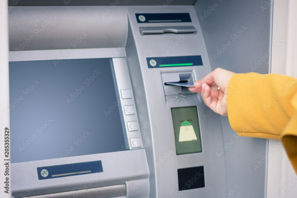 Withdrawing money from ATM. Withdrawing money from ATM.