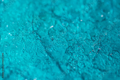 Bubble abstract blue water gel texture. Viscous petrolatum - macro photo