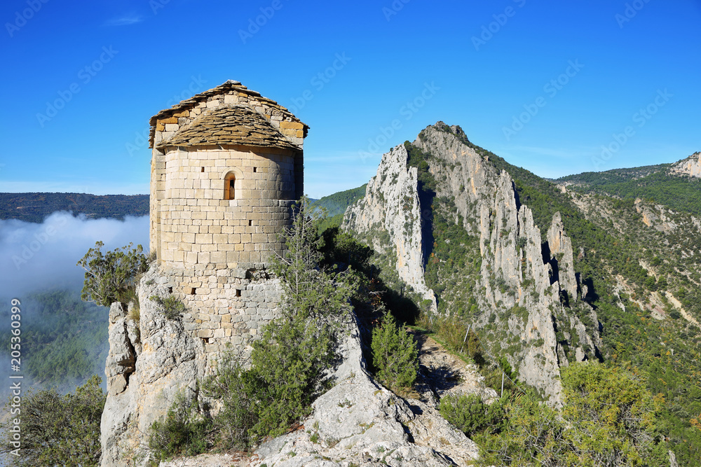 Romanesque Chapel of Mare de Deu de la Pertusa over the Canelles reservoir in Lleida, Catalonia, Spain.