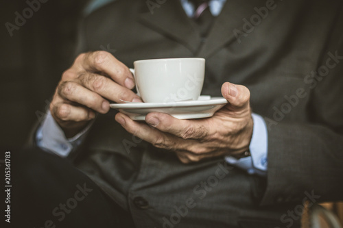 Close up image senior businessmen with a cup of coffee.
