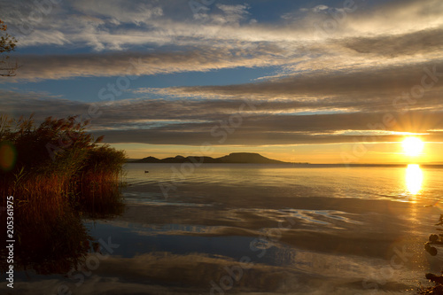 Beautiful sunrise over the lake Balaton of Hungary © Arpad