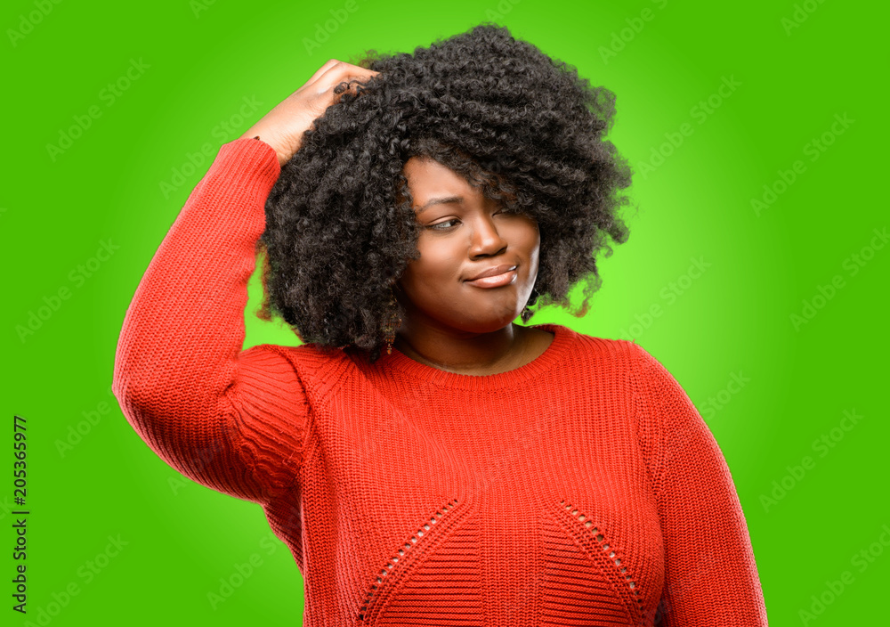 Beautiful african woman doubt expression, confuse and wonder concept, uncertain future Beautiful african woman doubt expression, confuse and wonder concept, uncertain future