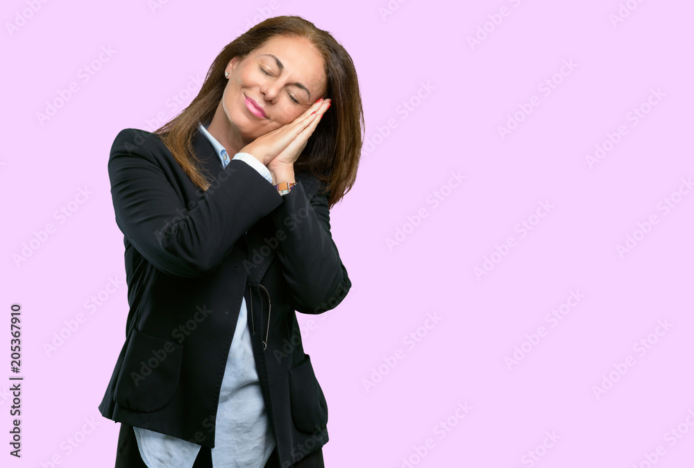 Middle age business woman tired and bored, tired because of a long day overworking Middle age business woman tired and bored, tired because of a long day overworking