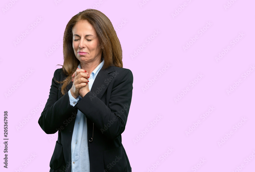 Middle age business woman crying depressed full of sadness expressing sad emotion Middle age business woman crying depressed full of sadness expressing sad emotion