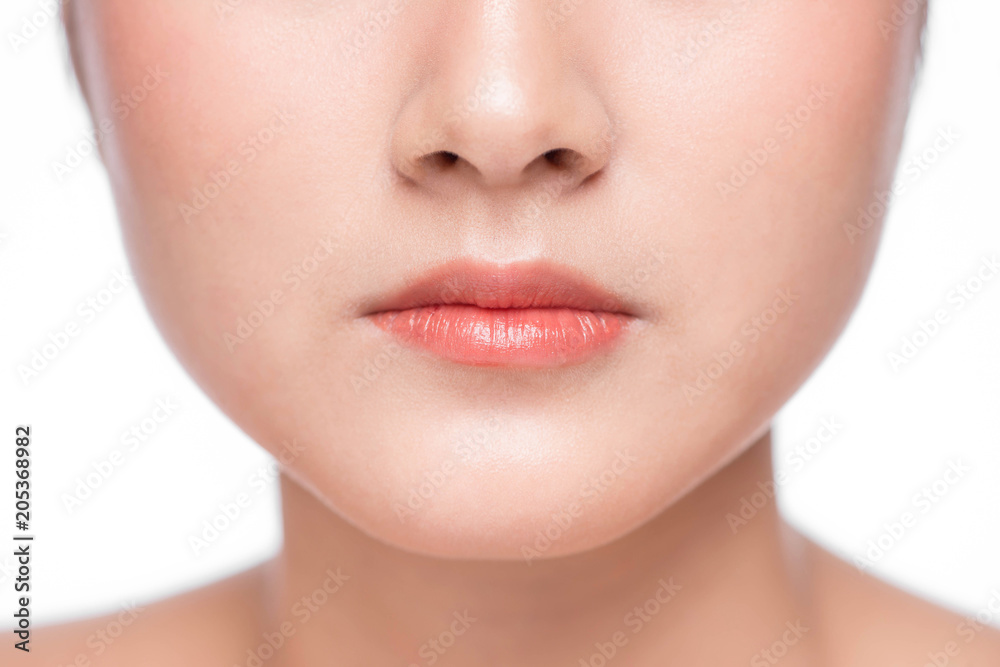 Young asian woman close up. Perfect natural lip makeup Young asian woman close up. Perfect natural lip makeup