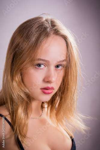 Young girl with beautiful eyes and red lips.