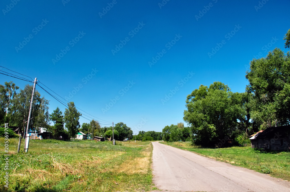 Country road against the blue sky