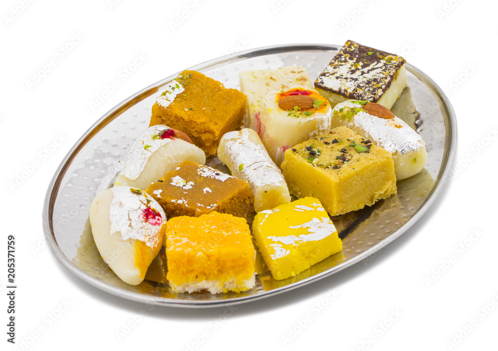Indian Delicious Mix Sweet Food or Mix Mithai isolated on White Background Indian Delicious Mix Sweet Food or Mix Mithai isolated on White Background