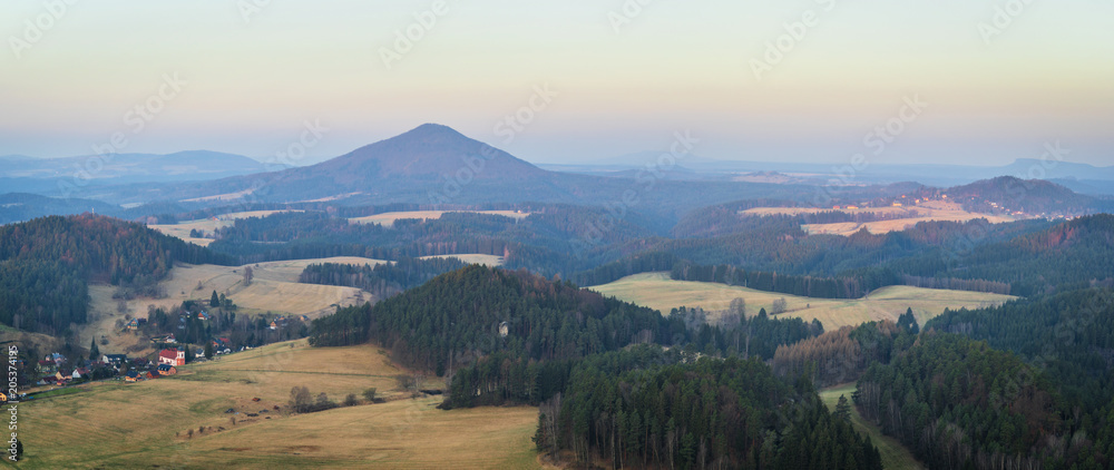 View to Bohemian Switzerland National Park from from the Mariina rocky hill in the Czech Republic, located  not far from Jetrichovice village at sunrise.

