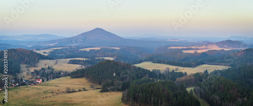 View to Bohemian Switzerland National Park from from the Mariina rocky hill in the Czech Republic, located not far from Jetrichovice village at sunrise. 
