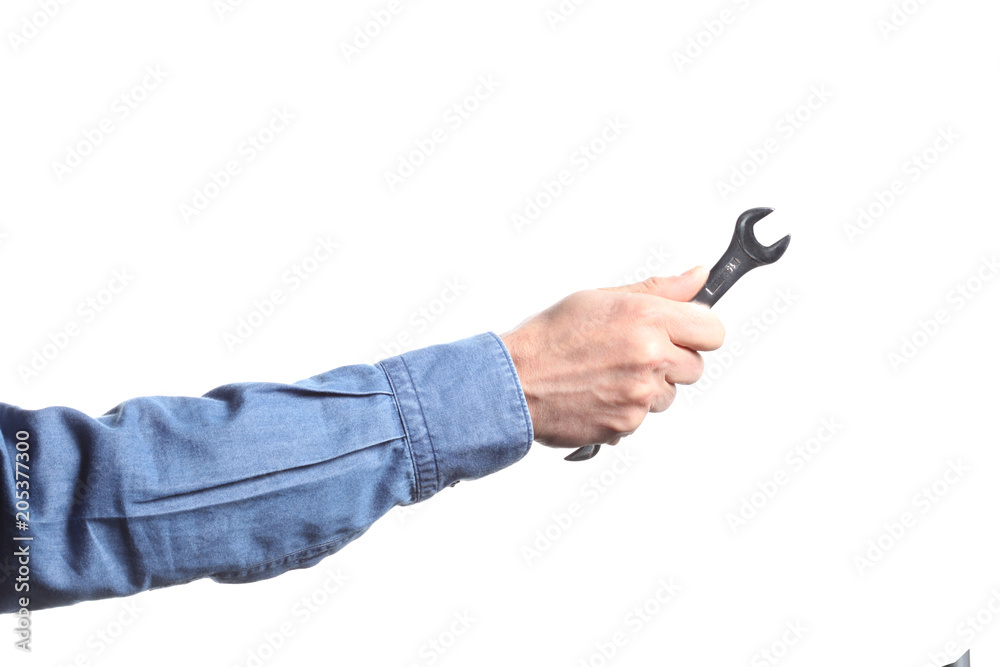 Fototapeta premium man's hand holding a wrench on white background with clipping path and copy space