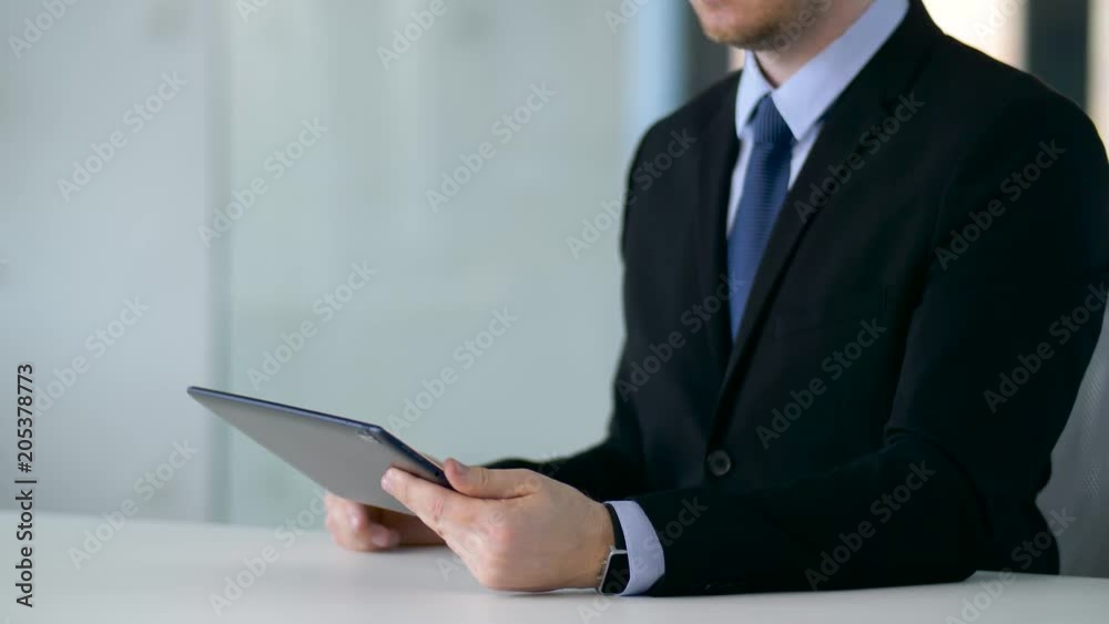 business, augmented reality and future technology concept - businessman working with tablet pc computer and something imaginary business, augmented reality and future technology concept - businessman working with tablet pc computer and something imaginary