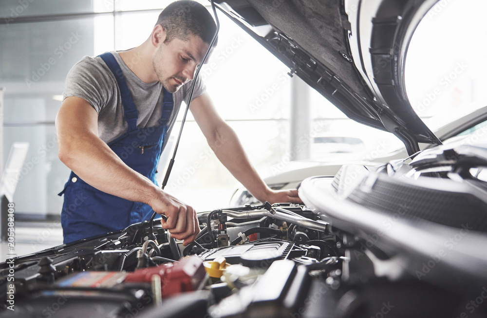 Auto mechanic working in garage. Repair service Auto mechanic working in garage. Repair service