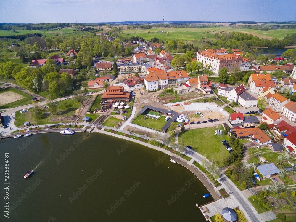 Obraz premium Aerial view of Ryn town, Poland (former Rhein, East Prussia). Medieval teutonic knights castle on the right