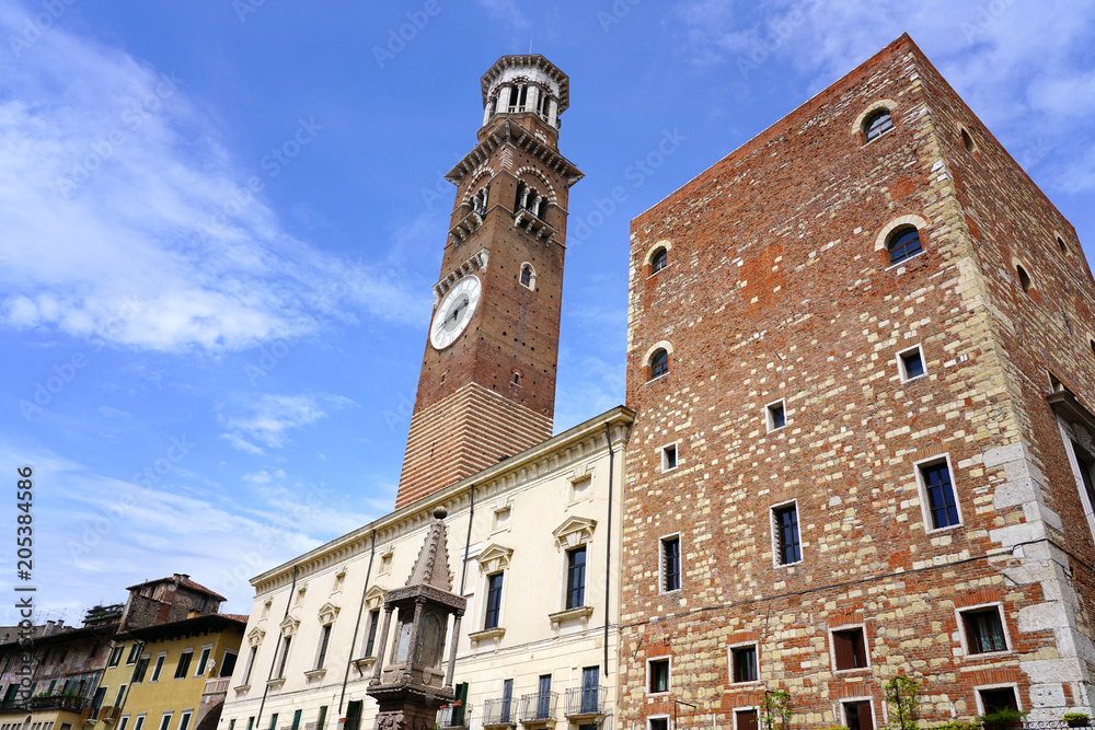 Tthe landmark historic Torre dei Lamberti, a medieval clock tower the old city of Verona, Italy