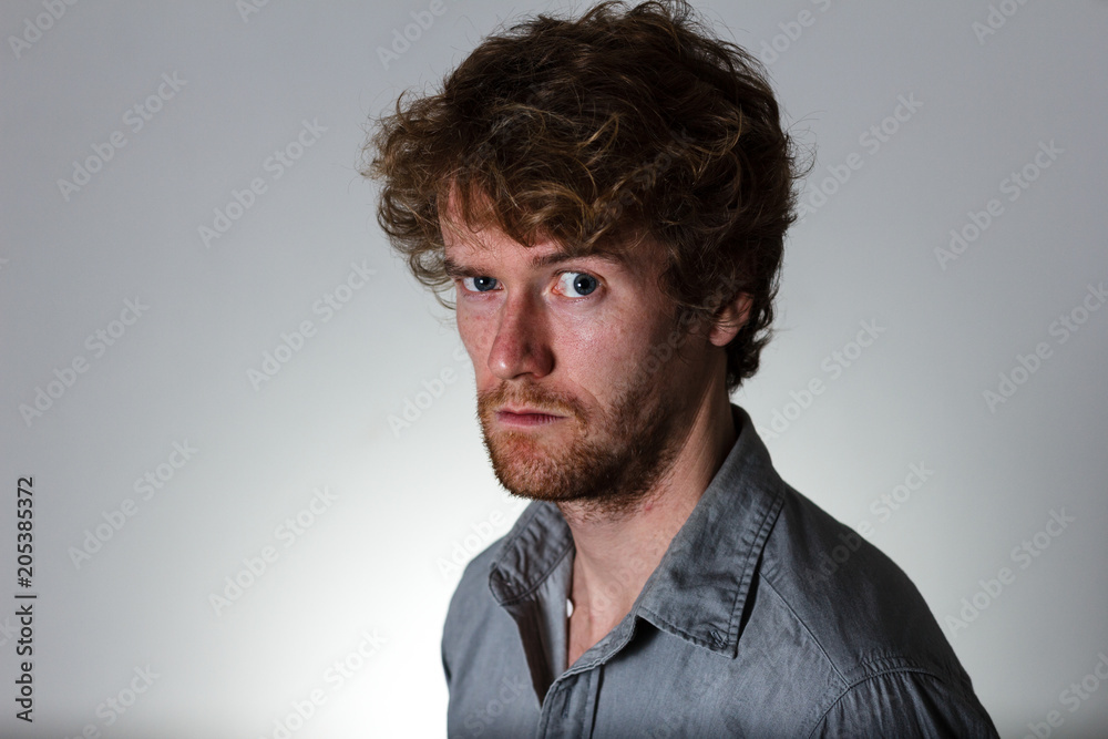 Young male with accusing expression Young male with accusing expression