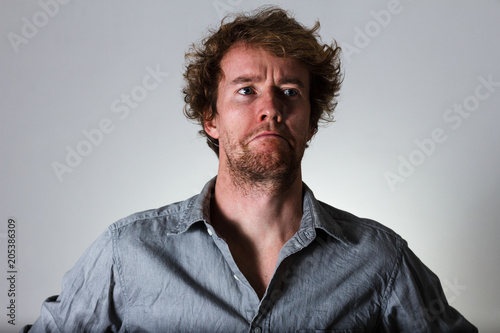 Fotografija Young man taking offence and being sullen