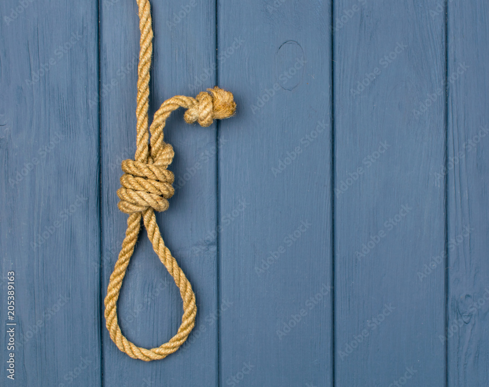Hinge for the gallows on a blue wooden background.