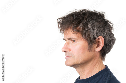 Side view of face seriously adult man on white background