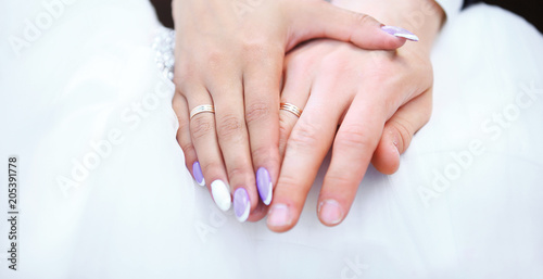 hands bride and groom with wedding rings