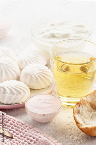 Protein products ingredients for breakfast marshmallows sour cream yogurt milk piece of bread green tea