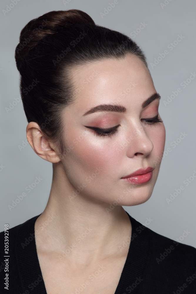 Fototapeta premium Young beautiful woman with stylish cat eye make-up